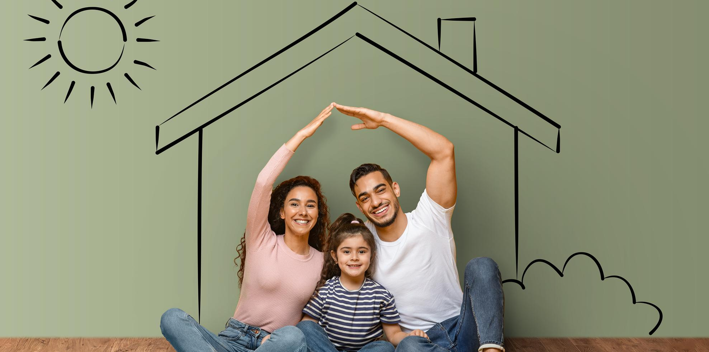 Happy family in front of their new home